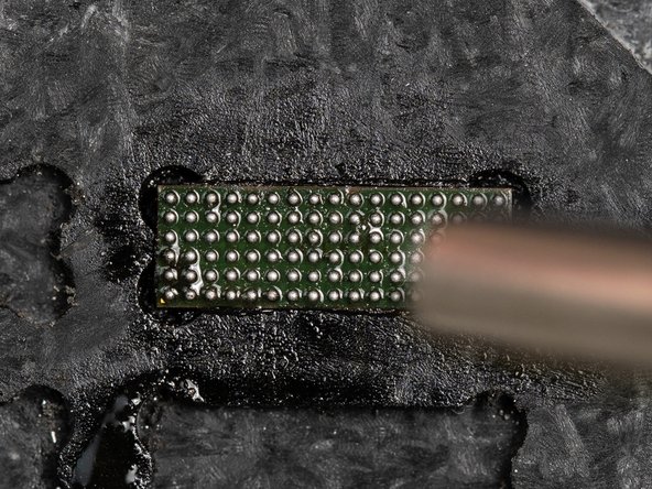 Heat the chip  back and forth with hot air at 300°C with 70 airflow.