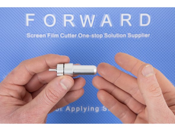 The blade holder will suck the blade in once you have most of the blade pushed in. So there's no need to force the blade, it'll go in easily.