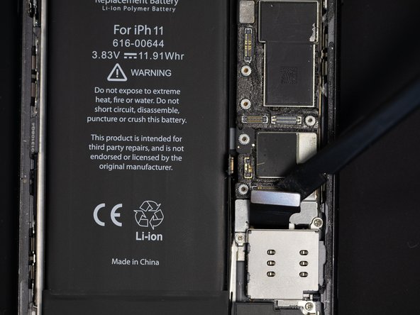 Using a spudger, disconnect the charging port flex.