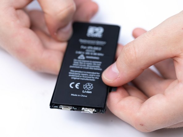 Fold the BMS board into place.