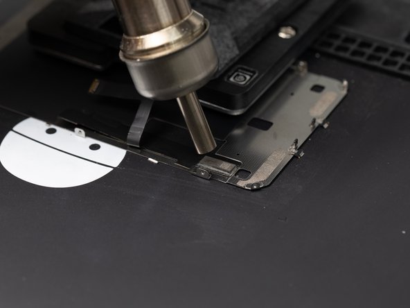 Instead of using a circular motion with the nozzle, bring your heat gun to the centre of the chip and hold it there for consistent heat.