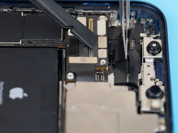 Use a pair of tweezers to gently push the loose flex cables out of the way so you can gain access to the infrared camera flex cable.