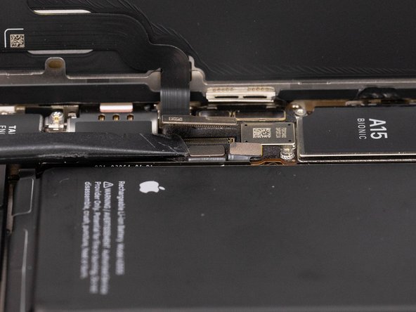 Disconnect the display cable with a spudger or fingernail.