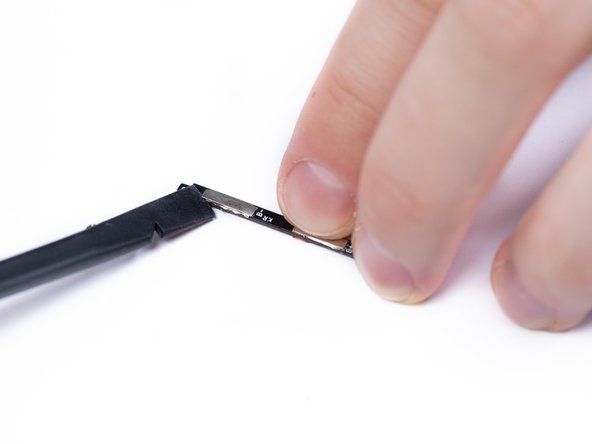 Lift the plates with a spudger.