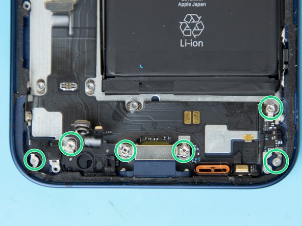 Remove the screws holding down the charge port.