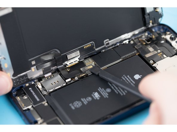 Disconnect the display cable with a spudger or fingernail.