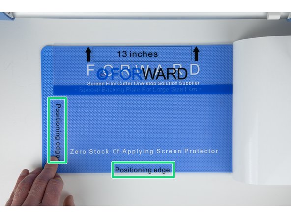 You'll need to line up your film with the two position edges on your grip layer.