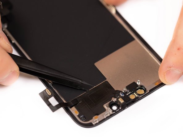 Using tweezers, gently slide one edge of the tweezers along the bottom of the proximity sensor flex. This will help create an opening for a pry card.