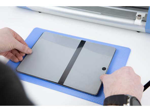 Take your time to line up the film to the corners on your iPad. Make sure there is no overlap on your home button.