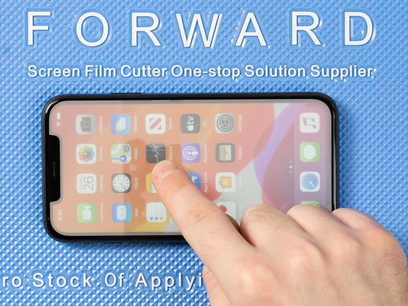 There's a thin sticky strip around 3/4 of the way up the film. This is the alignment strip and it allows you to temporarily stick the film down and align it correctly to the screen.