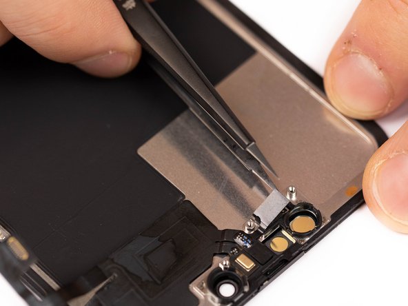 Using tweezers, lift the light sensor out of it's socket.