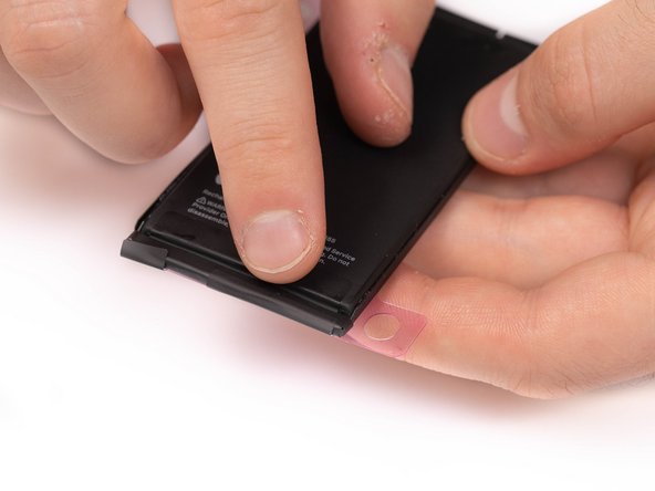 Using your finger, fold the four black tabs into place. Do this for every black tab.