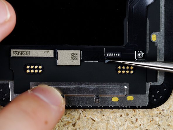 Peel off the cover up sticker thats covering the solder pads on the display. We used Kapton tape to keep the sticker in place.