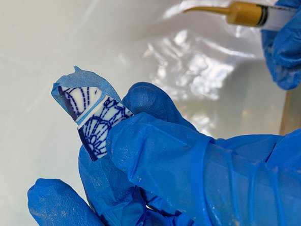 Tip: To make it easier to glue the small pieces together, put two small pieces on a piece of blue masking tape.