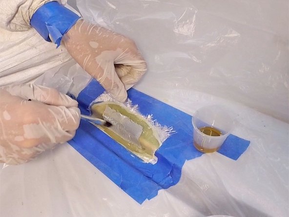 It’s important to apply only enough mixed epoxy to saturate the cloth. Cured epoxy is very hard to sand, so you don’t want a thick buildup.