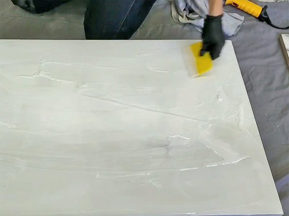 Use a clean plastic spreader to distribute the epoxy until it covers the top and surfaces at a uniform depth of about 1/8&quot;.