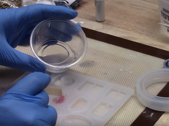 Example: Create an interesting droplet effect by adding small drops of colored alcohol ink pigments, then add droplets of the white alcohol ink on top. The white ink is heavier and will weigh down and sink the colored pigment drops. When you remove your piece from the mold, you'll see small,  colorful, floating droplets (as in the third image).