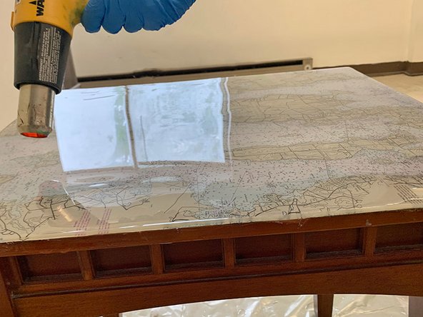 Allow the mixed epoxy to flow over the sides. Use a plastic spreader to help smooth the vertical edges.