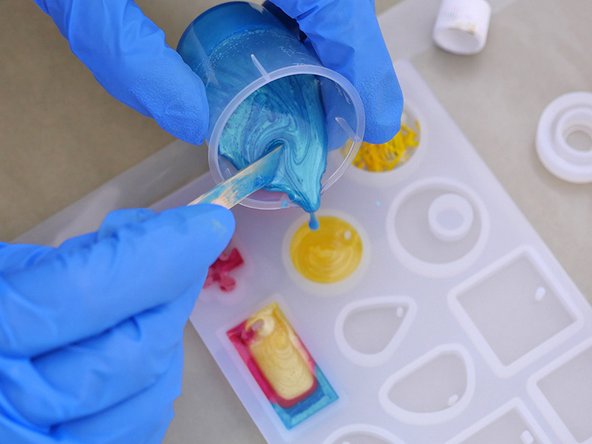 There are small syringes included in the TotalBoat Epoxy Jewelry Kit. Fill them with tinted mixed epoxy and use them to help control the color placement by injecting a little color just where you want it.