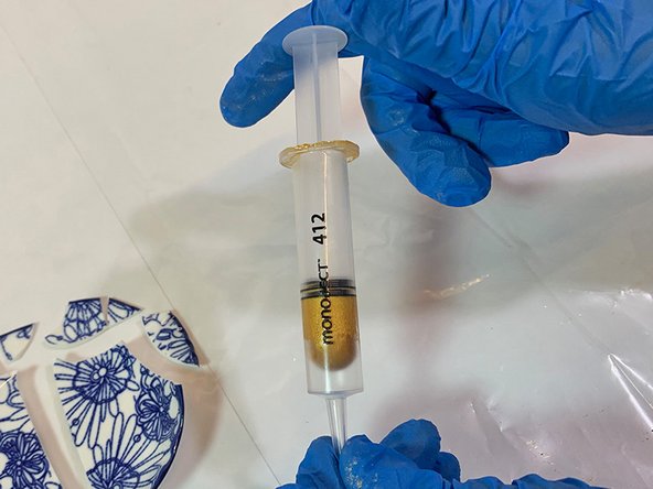 Slowly insert the plunger until the epoxy moves down to  the tip.