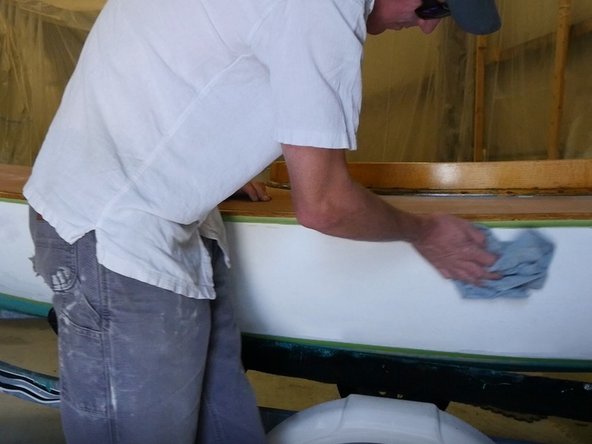 Do not sand through the primer; sand just enough to remove high spots and give the topside paint a good surface to stick to.