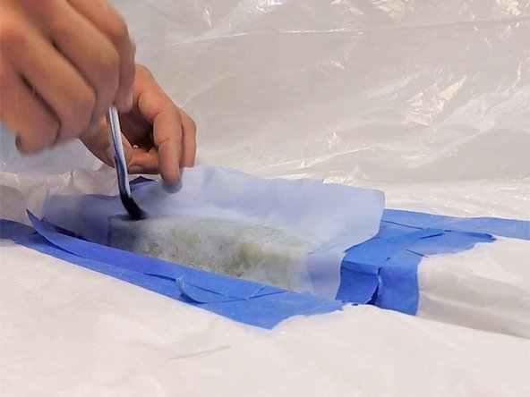 Cut and position peel ply: Cut a piece of peel ply large enough to cover the repair area, and lay it on top of the final coat of epoxy.