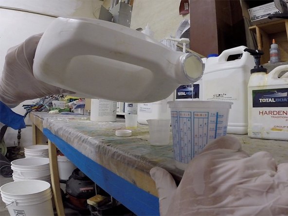 You will use mixed, unthickened epoxy (no filler) to wet out small pieces of fiberglass cloth to patch the repair area.