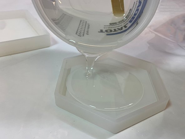 Pour mixed epoxy slowly into the mold to avoid splashing and prevent excess air bubbles.