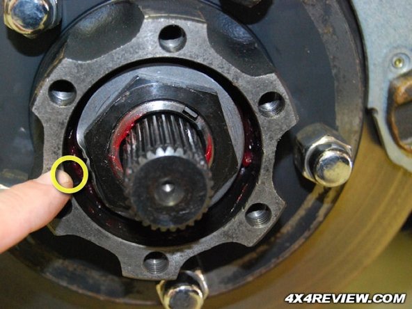 It is not necessary to remove caliper from brake line but it is important that the caliper be securely supported and not be hung by the brake line
