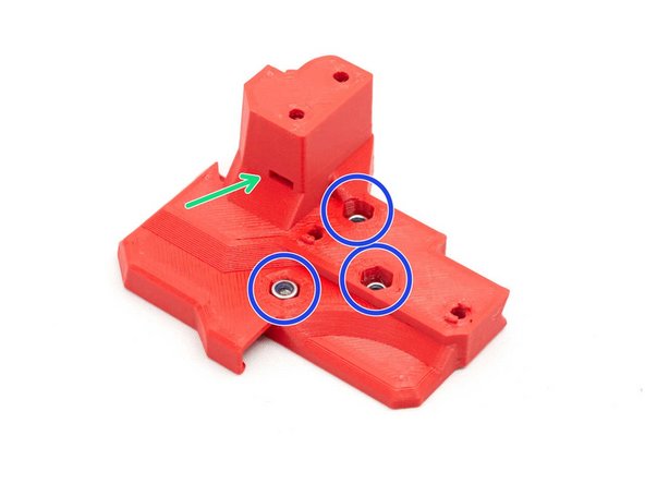 Insert three M3 nylock nuts in body_back