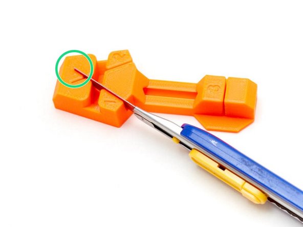 Verify that the blade is at the bottom of the slit and parallel to bottom of the jig.