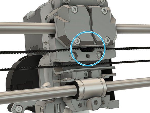 If you have difficulties to pass the belt around the idler you can tape the belt end with the end of a zip tie. Then, feed the zip tie into the idler.