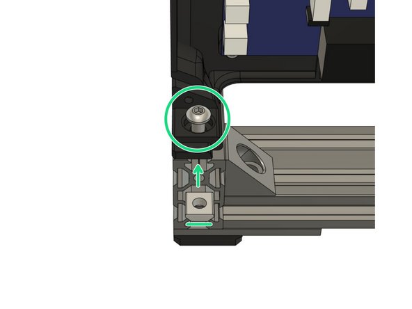 Insert a t-nut and M5x8mm screw in the on the back extrusion as shown in the picture.