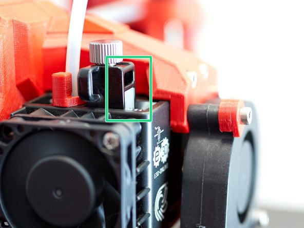 As a starting point to adjust the extruder tension, E3D recommends to rotate the tensions screw until the white part is flushed with the front of the black part.