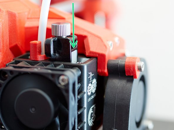 As a starting point to adjust the extruder tension, E3D recommends to rotate the tensions screw until the white part is flushed with the front of the black part.