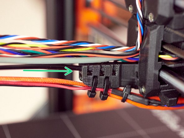 Insert the 3 mm nylon filament into the end of the cable_guide_back.