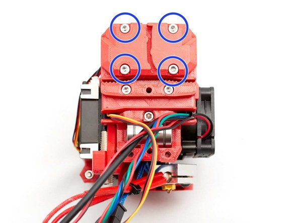 Make sure the nozzle fan, stepper motor, pinda and hotend fan cables are routed in between the smooth rods