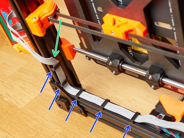 Create a twisted loop with the LCD cables under the front of the frame. Don't pinch the cables!
