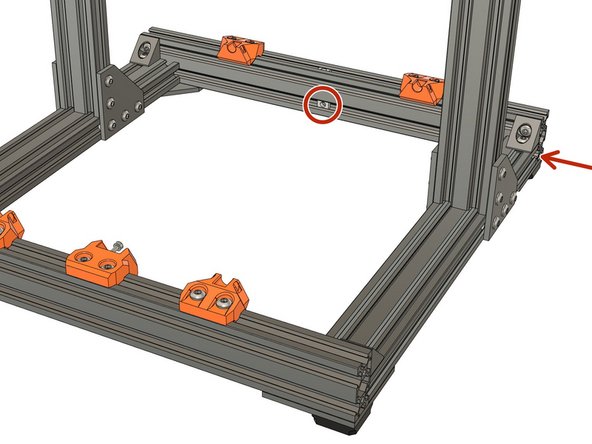 Slide 1x t-nut into the lower channel of the rear extrusion, as shown.