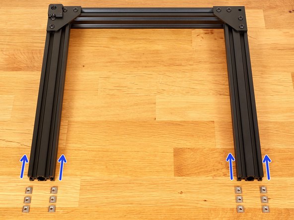 Take 12 of the previously tested t-nuts. Insert them, as shown, in both 20mm sides of the extrusions.