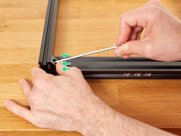 The angle corners might pull the frame slightly out of alignment as you tighten them, we will correct this in the next step. Applying pressure, to hold them tight against the extrusions, while tightening the screws, helps to reduce this.