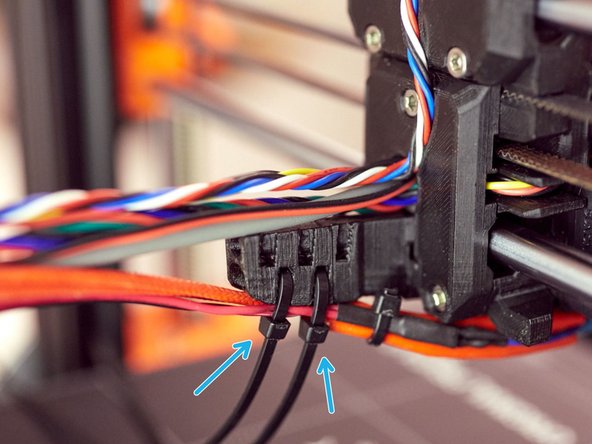 Using two zip ties, attach the hotend cables.