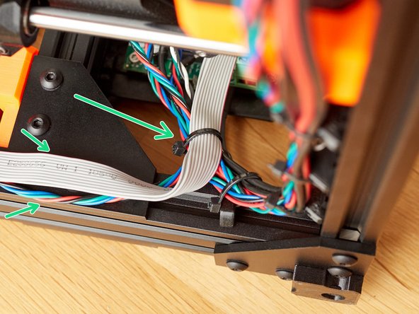 Add 3 zip ties to the PSU and right Z motor mount cables. Carefully tighten them.