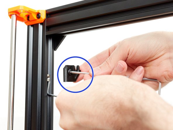 Using a hex key (or a zip tie) move the t-nut upper and hold it in place with one hand.