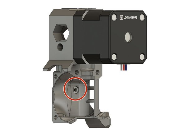 Press an M3 hex nut into the extruder_body.