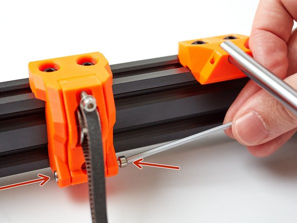 Insert an M3 locknut into the left side of the y_idler_mount and thread an M3x30 screw from the other side. Use this screw to help seat locknut correctly, in the part. Do not over-tighten this screw, the y_idler_tensioner should move with almost no resistance.