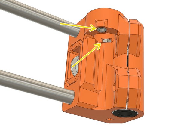 Insert two M3 hex nuts in the dedicated pockets of the x_end_idler.