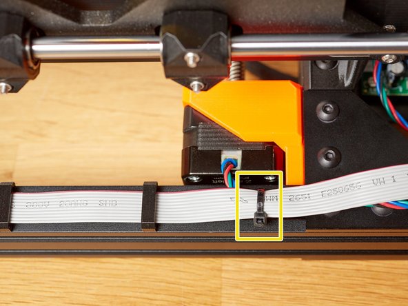 Insert a zip tie and place the left Z motor cable over the cable_clip_vertical.