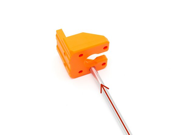 Take one of the Z smooth rods, which you disassembled from your Prusa, and test fit it into the Z motor mount hole.