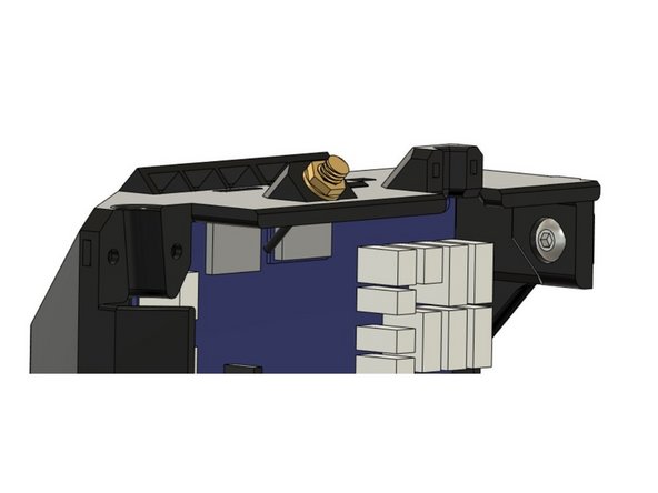 Insert a M5x8mm screw into the pocket on the top of the case. We will use this screw to secure the case to the Z extrusion on the frame.